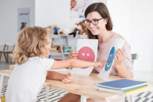 Child doing ABA therapy with therapist